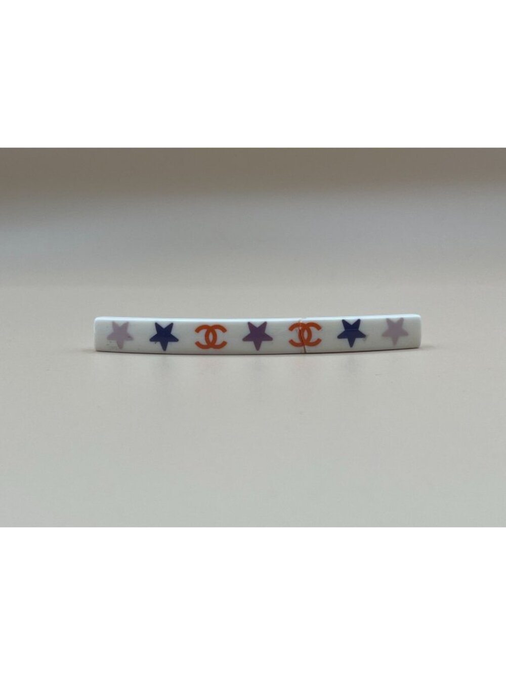 Authentic vintage Chanel bar barrette in cream-white resin, printed with two red